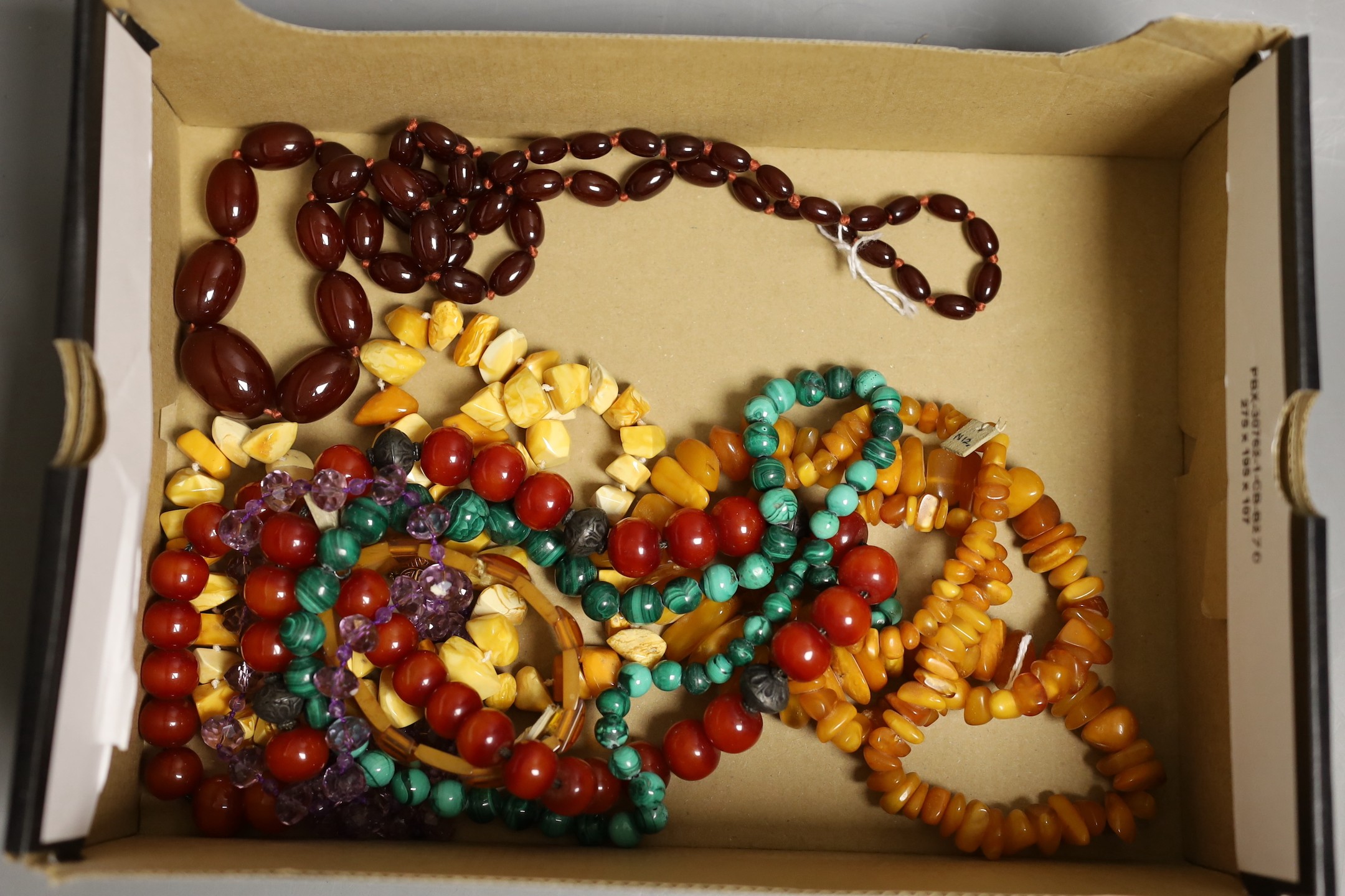 A group of assorted bead necklaces including amber